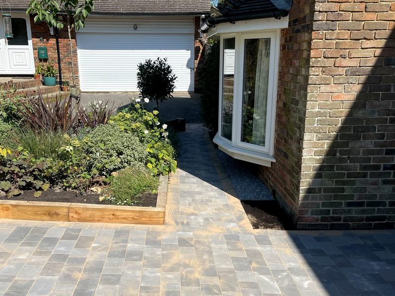 Porcelain patio with raised planting beds